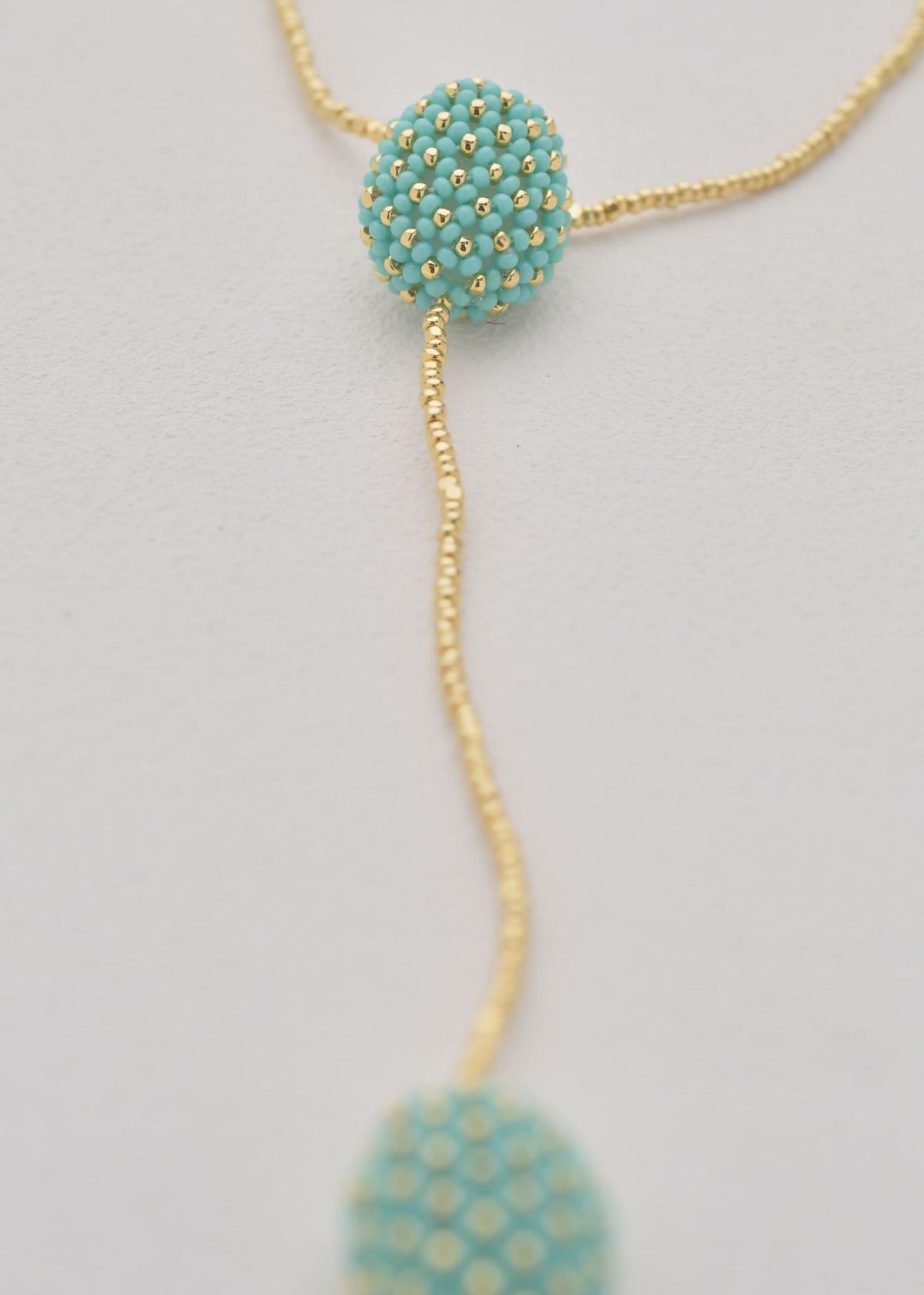 COLLAR DOS TAWARI ORO AZUL TURQUESA LUSTRE
