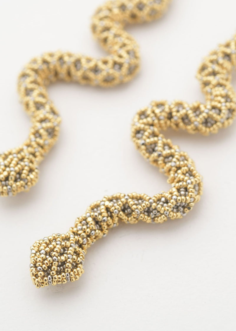 ARETES SERPIENTE NAWI ORO PLATINO