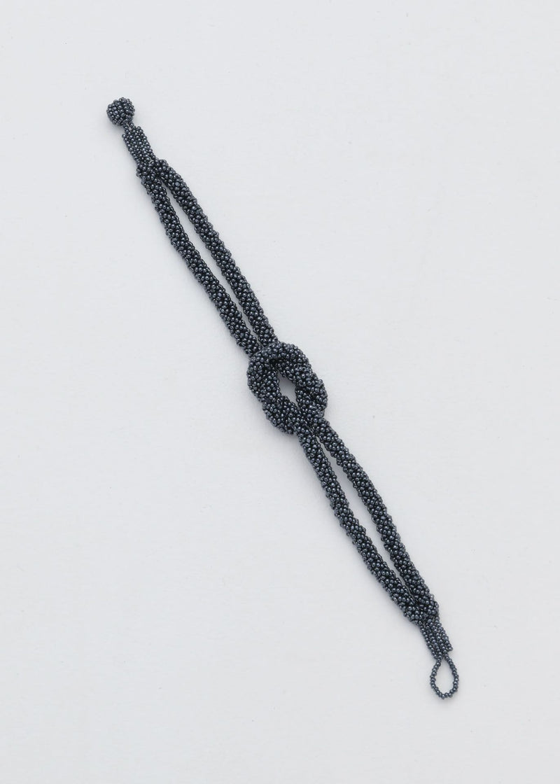 BRAZALETE NUDO TAWARI GRIS METALICO
