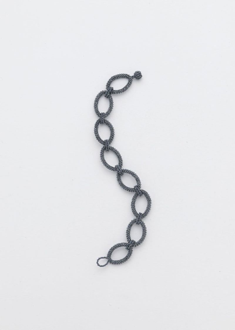 BRAZALETE AROS TAWARI GRIS METALICO