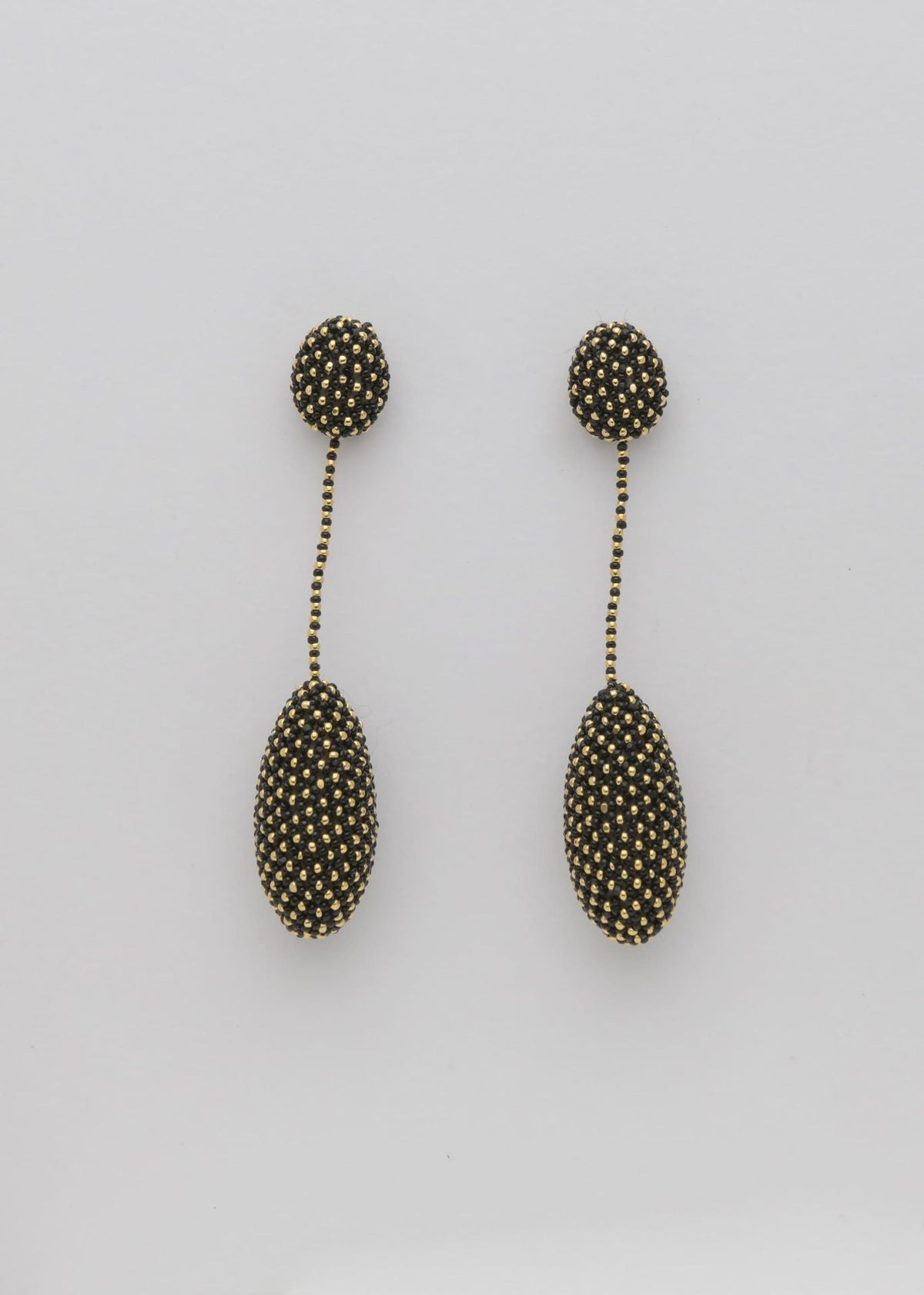 ARETES COLGANTES TAWARI ORO NEGRO