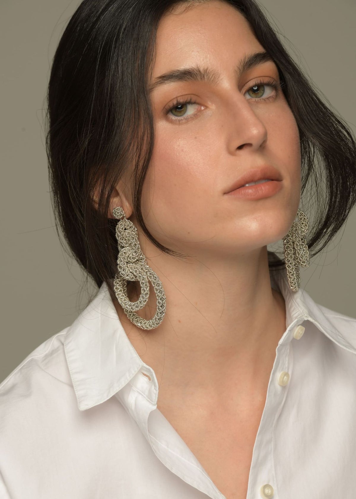 ARETES CINCO AROS NAWI PLATA PLATINO