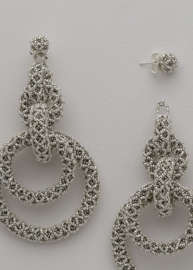 ARETES CINCO AROS NAWI PLATA PLATINO