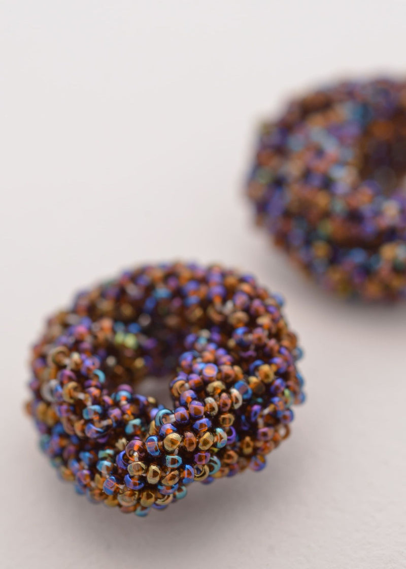 BROQUELES HAIKURI TOPAZ MORADO TORNASOL