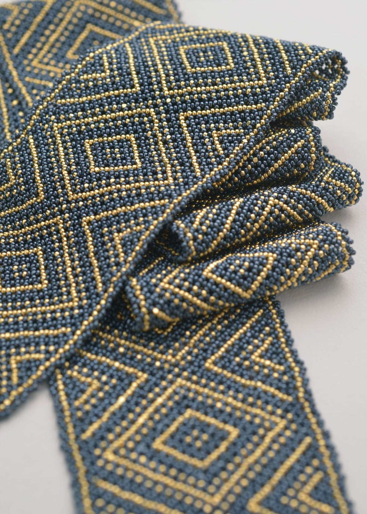 PAÑOLETA ORO GRIS METALICO