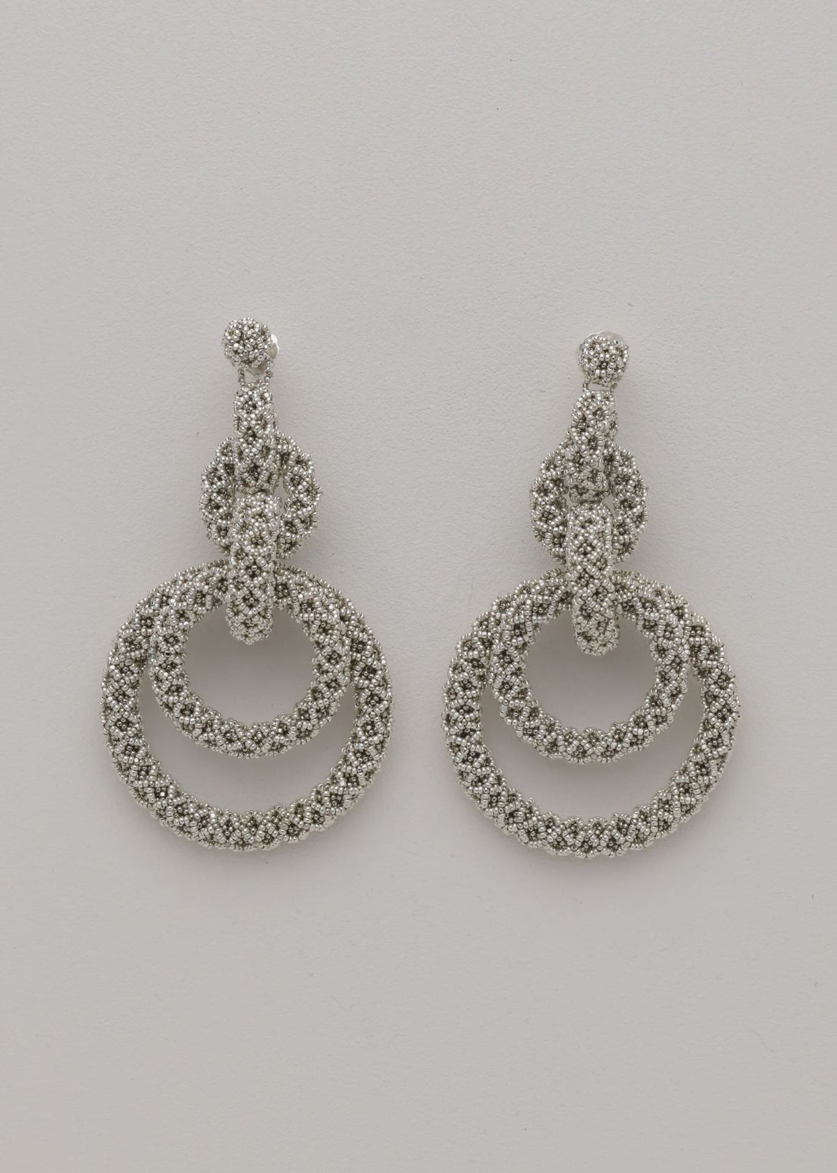 ARETES CINCO AROS NAWI PLATA PLATINO